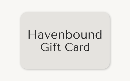 Warm stone color background image as a horizontal rectangle with rounded edges. With Havenbound centered in the rectangle, and Gift Card is center under Havenbound. 